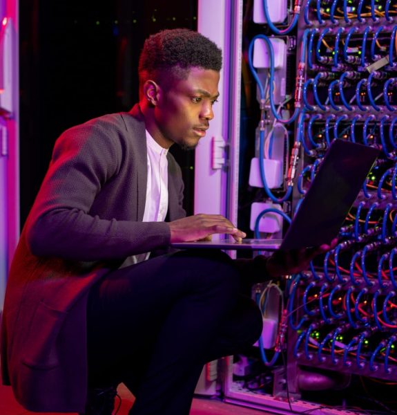 african-american-it-engineer-analyzing-work-of-ser-2023-11-27-04-54-12-utc-min.jpg
